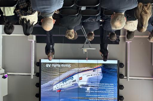 Foto av presentation och publik