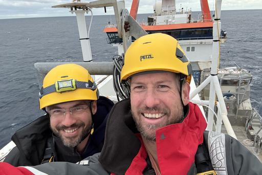 two researchers wearing helmets