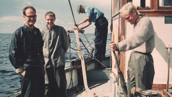 Four men on board a boat.