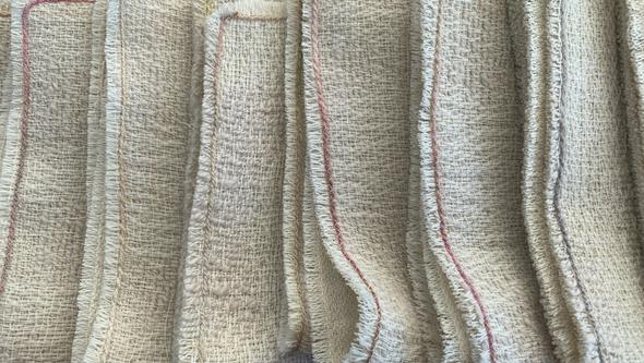 Bilder på ljusbeige vävda filtar