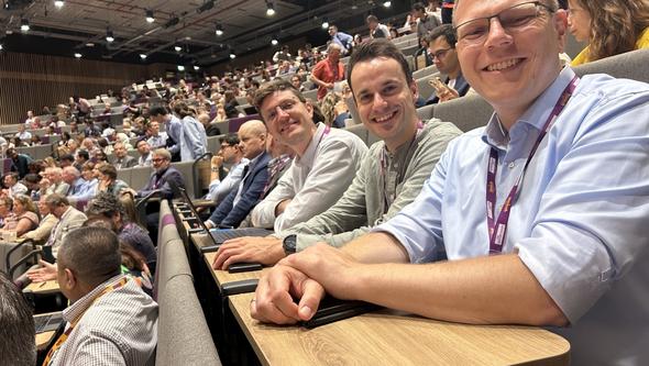 Photo of researchers at the conference