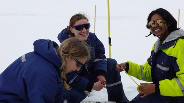 Researchers on a glacier wrapping icecores.