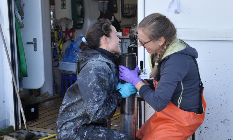 Irina on deck with dirty sediment core
